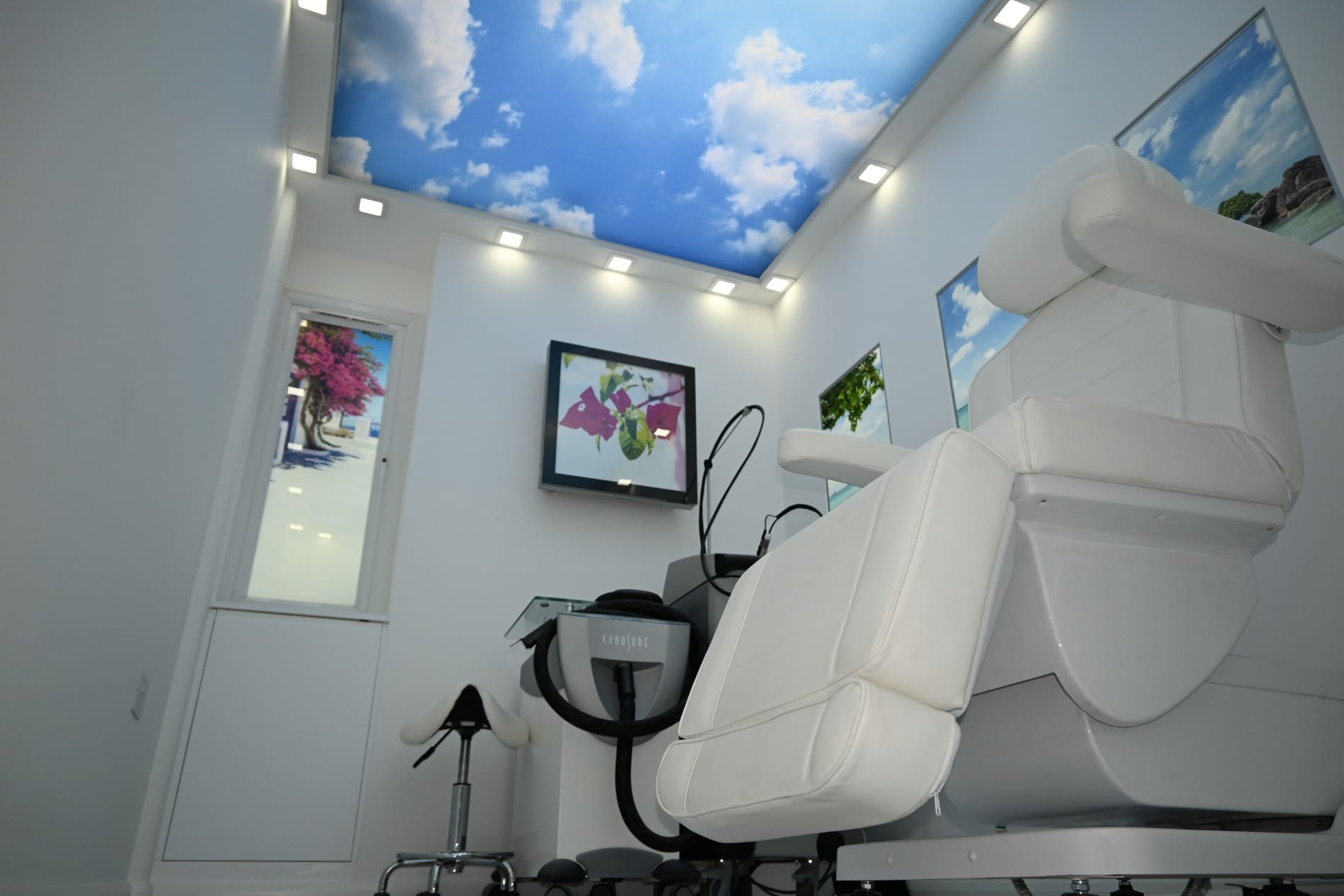 White treatment chair under a blue sky ceiling panel